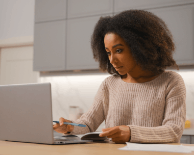 A student compares a translated transcript using Haitian Creole Translation Services in New York for academic review.