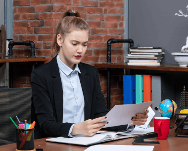 An analyst reviews a translated audit report using Russian Translation Services in New York for financial filings.