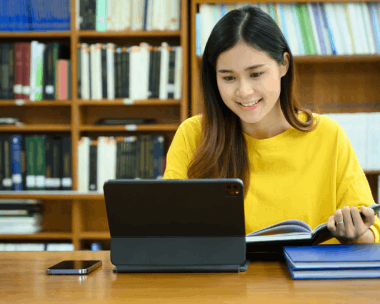 A student checks a certified transcript packet as Russian Translation Services in New York prepares academic records.