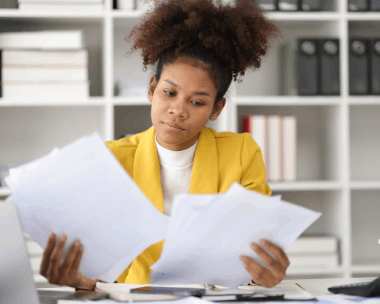A translator edits certified engineering specs with Haitian Creole Translation Services in New York for precise terms.