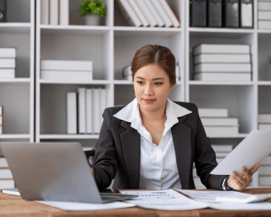 An ATA-certified translator checks legal briefs from a law firm using Spanish Translation Services in New York for accuracy.