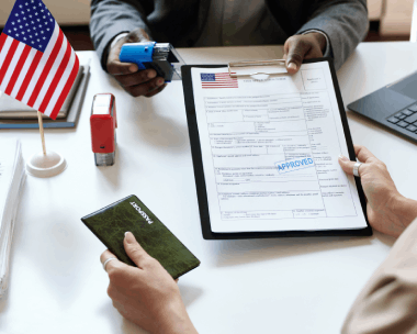 A translator stamps a certified packet for USCIS, showing Spanish Translation Services in New York for immigration forms.