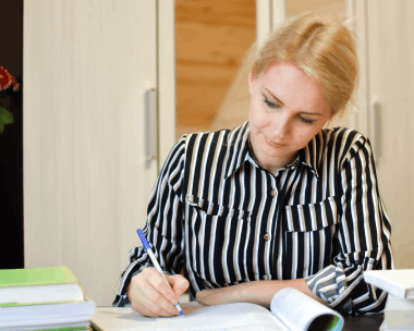 A student scans transcripts for Translation Services in Manhattan, preparing accurate document translation for admissions.