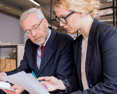 A translator helps a customer with babylon translation services for excellent document translations needed for immigration.