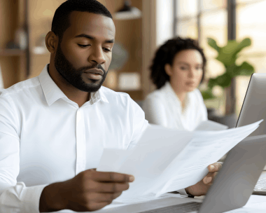 A client requests a free quote for Haitian Creole Translation Services in New York on a laptop with project details.