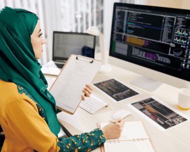 An IT lead edits Arabic API documentation using Arabic Translation Services in New York City for technical content.