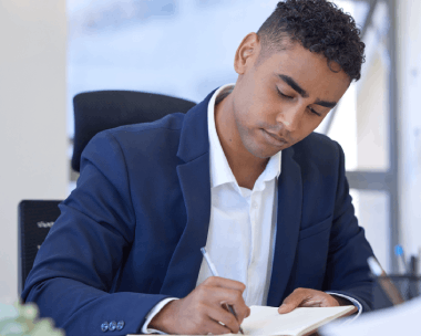 A translator reviews a translated affidavit with Haitian Creole Translation Services in New York before signing for court.