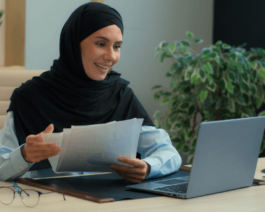 A translator compares Arabic, French, and Korean pages using Arabic Translation Services in New York City for multilingual.