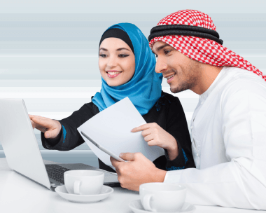 Two translators check a countdown timer as Arabic Translation Services in New York City deliver a 24-hour rush document.