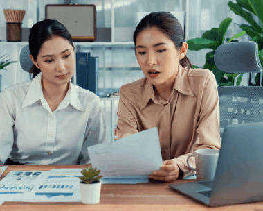 An analyst checks a translated earnings report using Chinese Translation Services in New York for finance industry filings.