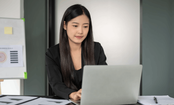 A translator checks terminology on screen, delivering accurate Chinese Translation Services in New York for clients.
