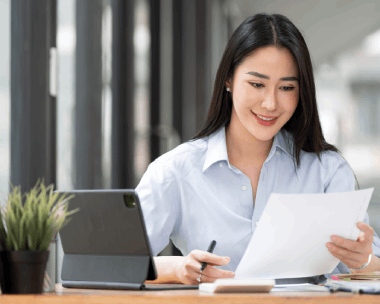 A manager reviews a bilingual contract draft using Russian Translation Services in New York for business approvals.