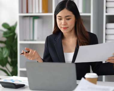 A translator updates a terminology glossary for professional documentation with Translation Services in Flushing on a laptop.