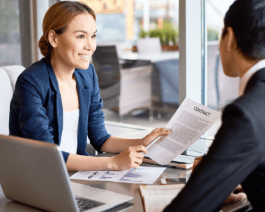 A broker reviews a bilingual purchase contract as Korean Translation Services in New York clarify real estate clauses.