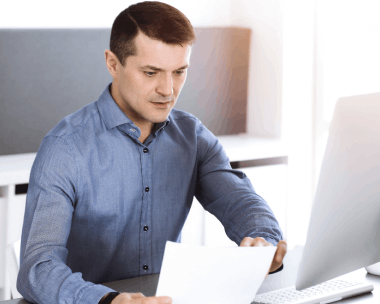 A business manager reviews a bilingual contract with Translation Services in Manhattan for startup compliance and trust.