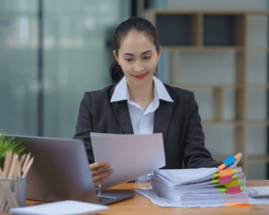 A translator reviews a legal contract for compliance using Translation Services in Queens to preserve meaning and format.