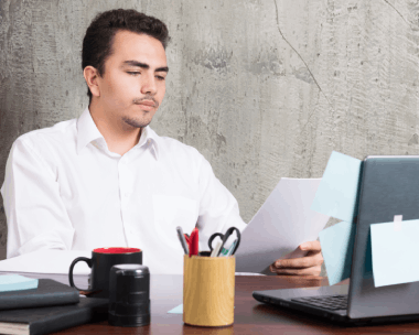 A project manager uploads files for urgent day delivery using Spanish Translation Services in New York on a laptop.